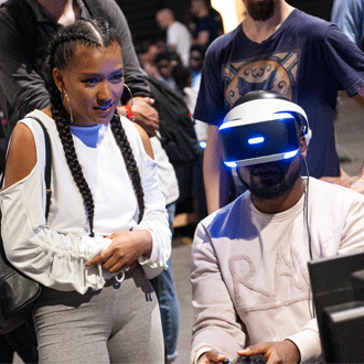A man playing with Vr at the Play Expo