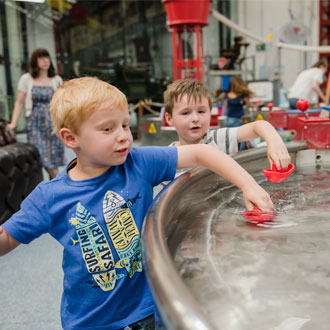 Children playing with exhibits at Enginuity! 